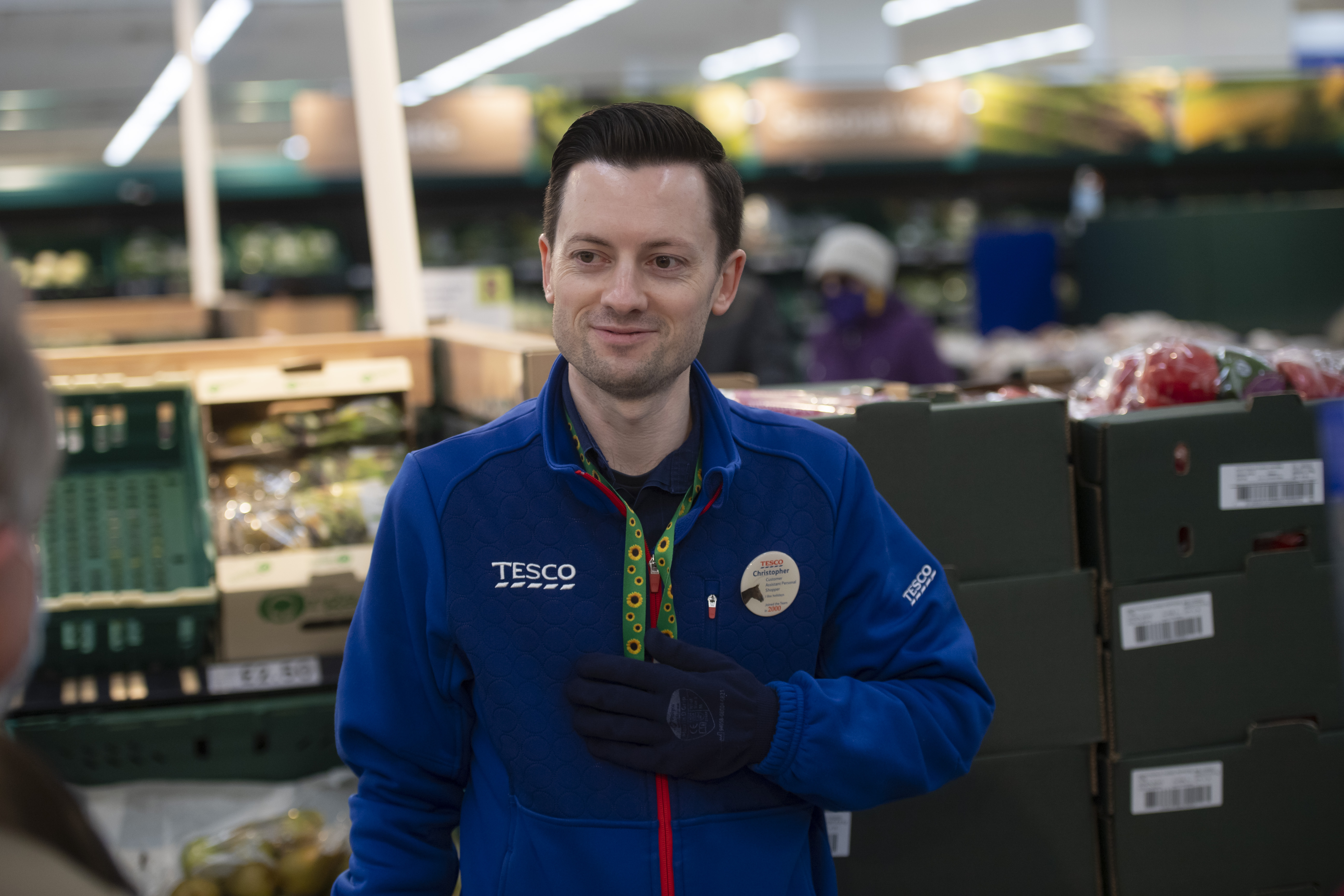 Tesco colleague in the produce aisle